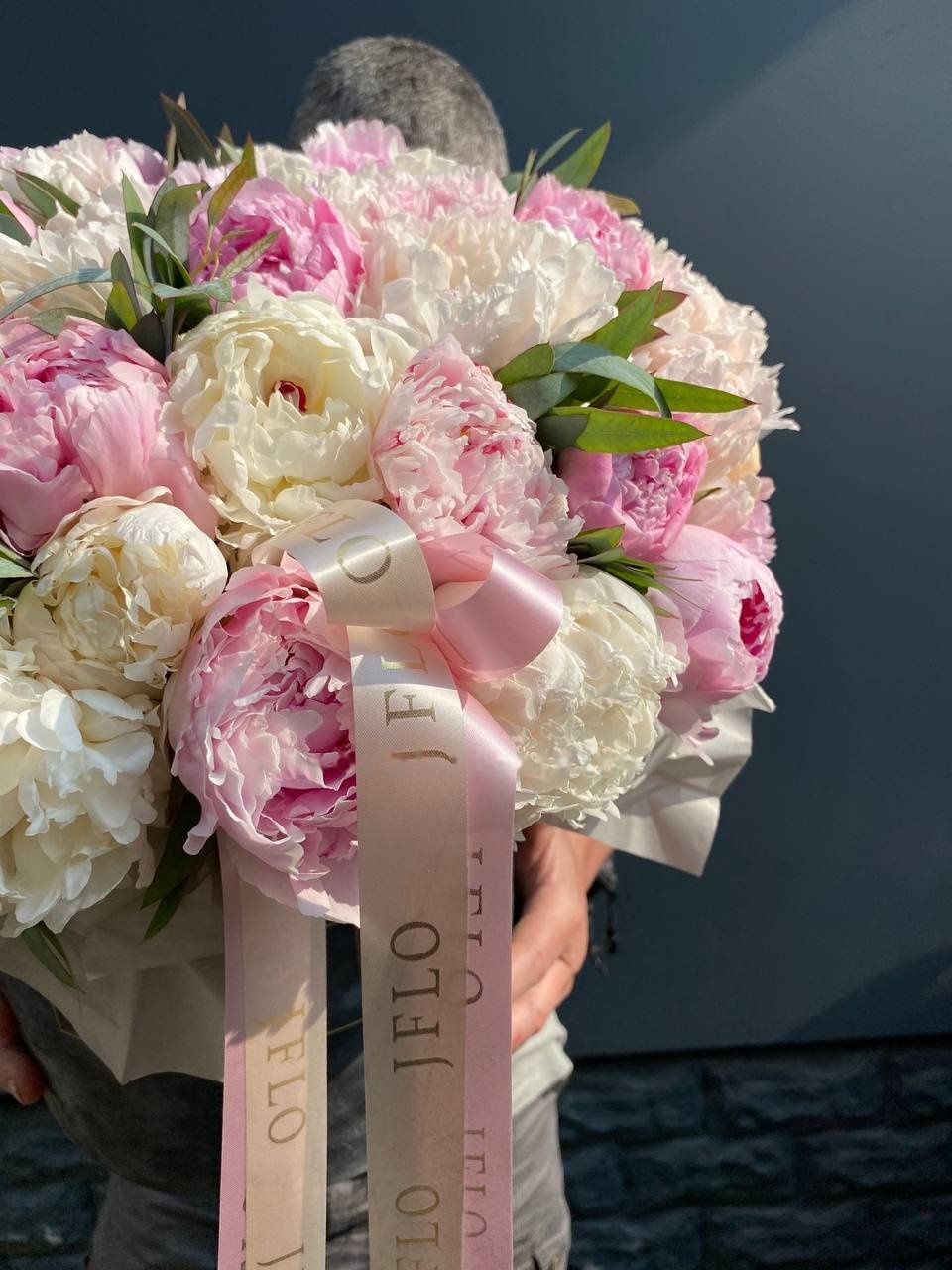 Wedding bouquet of Coral Charm peonies and white roses for a Rotterdam ceremony