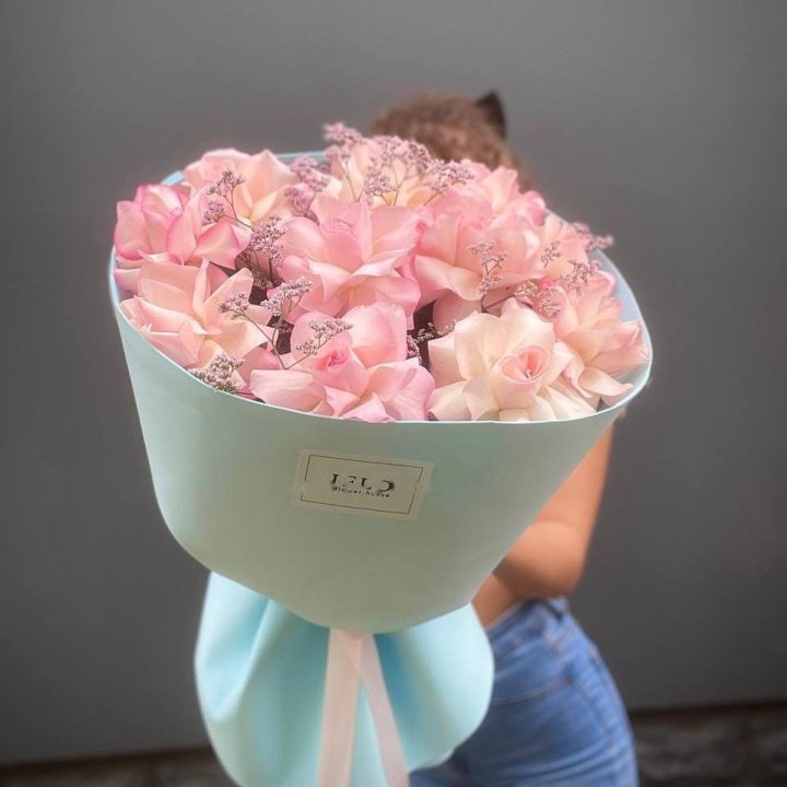 Coral roses of several cultivars gathered in one bouquet