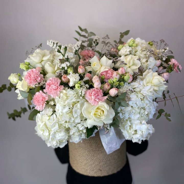 Flowers in a stone planter on an office reception counter